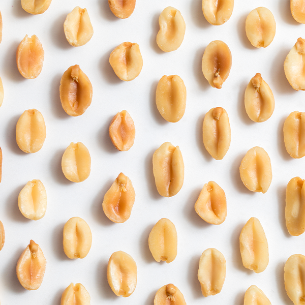 Flat lay image of halved peanuts